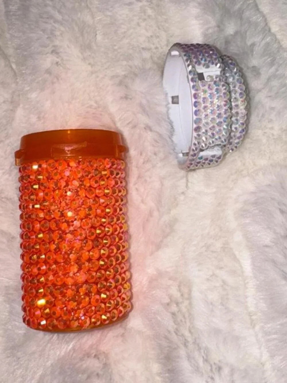 Orange rhinestone bottle with silver cap